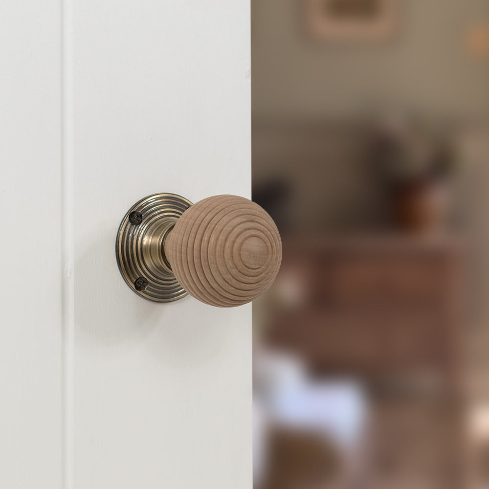 Quality image of Old English Bridlington Wood Reeded Beehive Door Knob on Face Fix Rose - Antique Brass | Sku. oe57rmkab | available from Trade Door Handles.