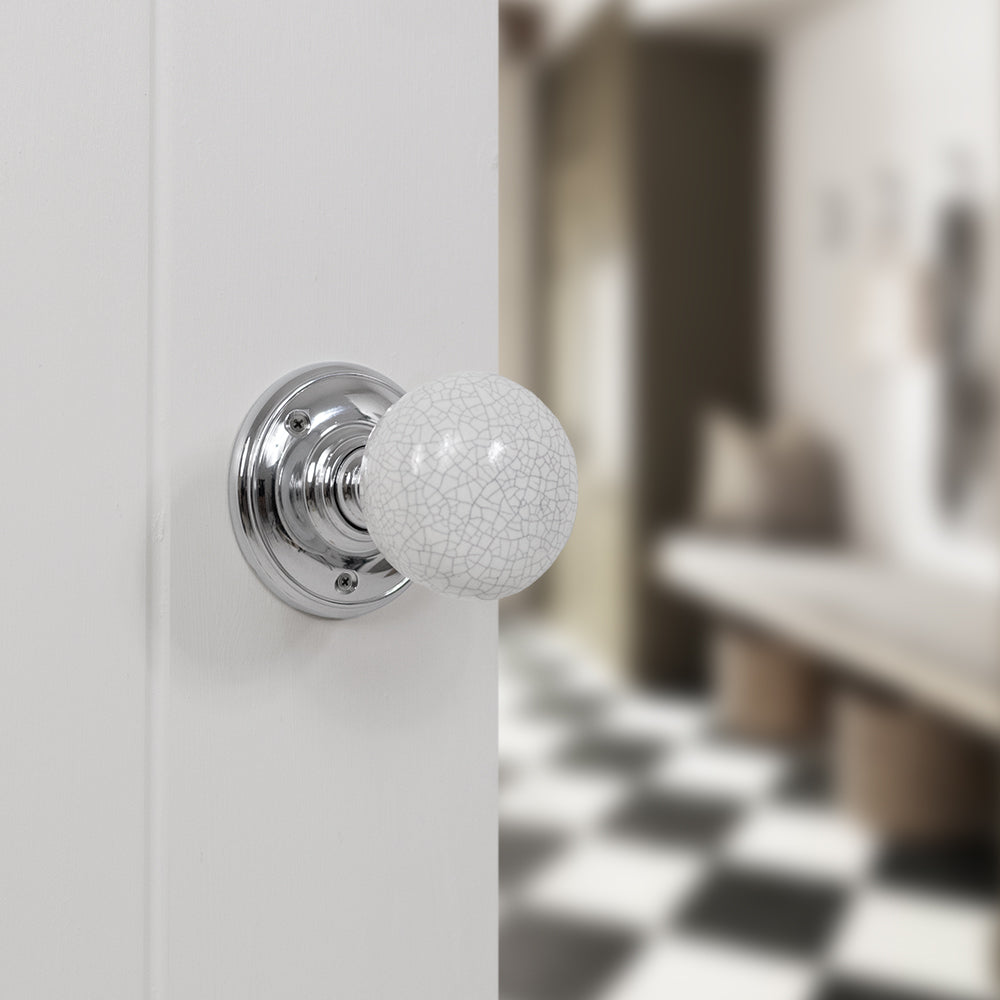 Quality image of Old English Skipton Porcelain White Crackle Door Knob on Face Fix Rose - Polished Chrome | Sku. oe59cmkwhpc | available from Trade Door Handles.