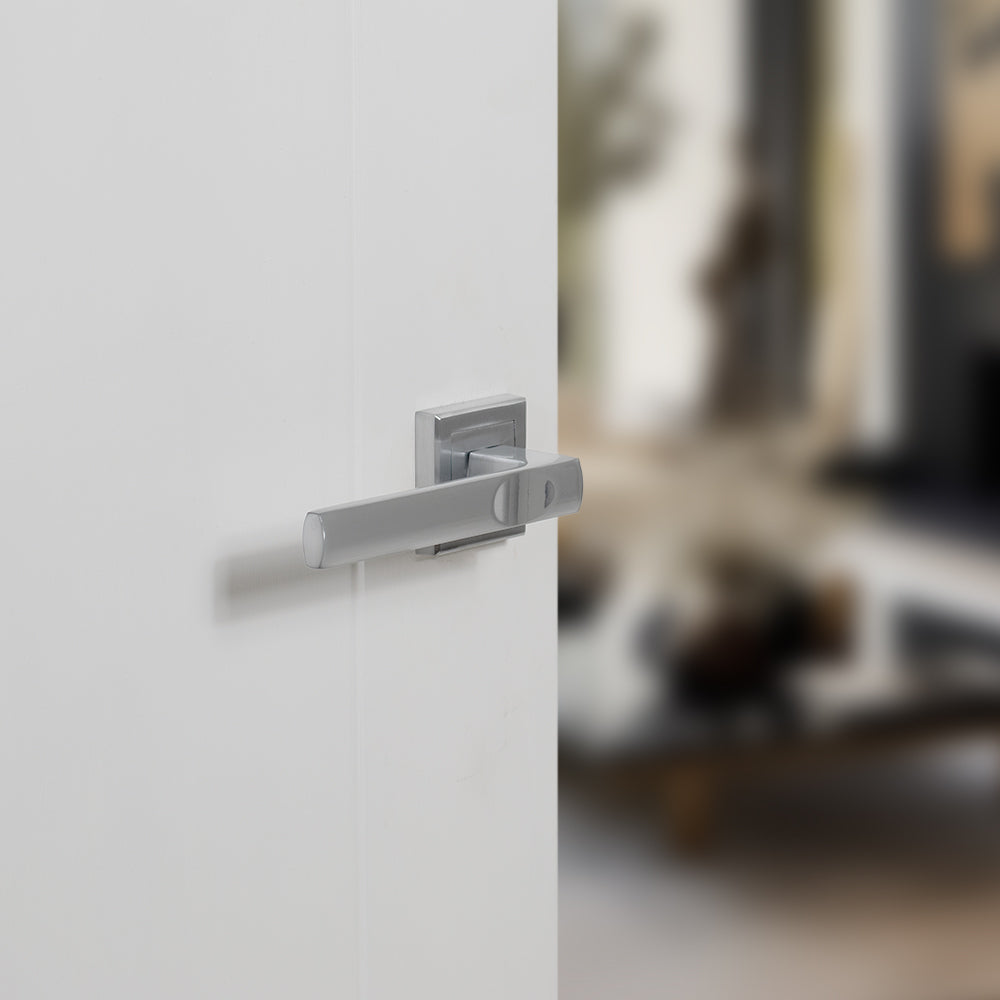 Quality image of STATUS Kansas Lever Door Handle on Square Rose - Satin Chrome | Sku. s24ssc | available from Trade Door Handles.