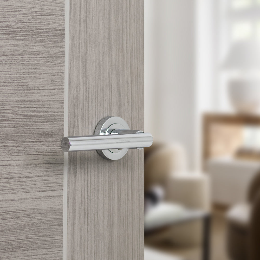 Quality image of STATUS Nebraska Lever Door Handle on Round Rose - Polished Chrome | Sku. s28rpc | available from Trade Door Handles.
