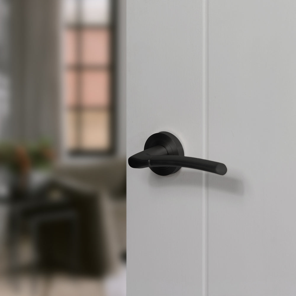 Quality image of STATUS Indiana Lever Door Handle on Round Rose - Matt Black | Sku. s33rmb | available from Trade Door Handles.