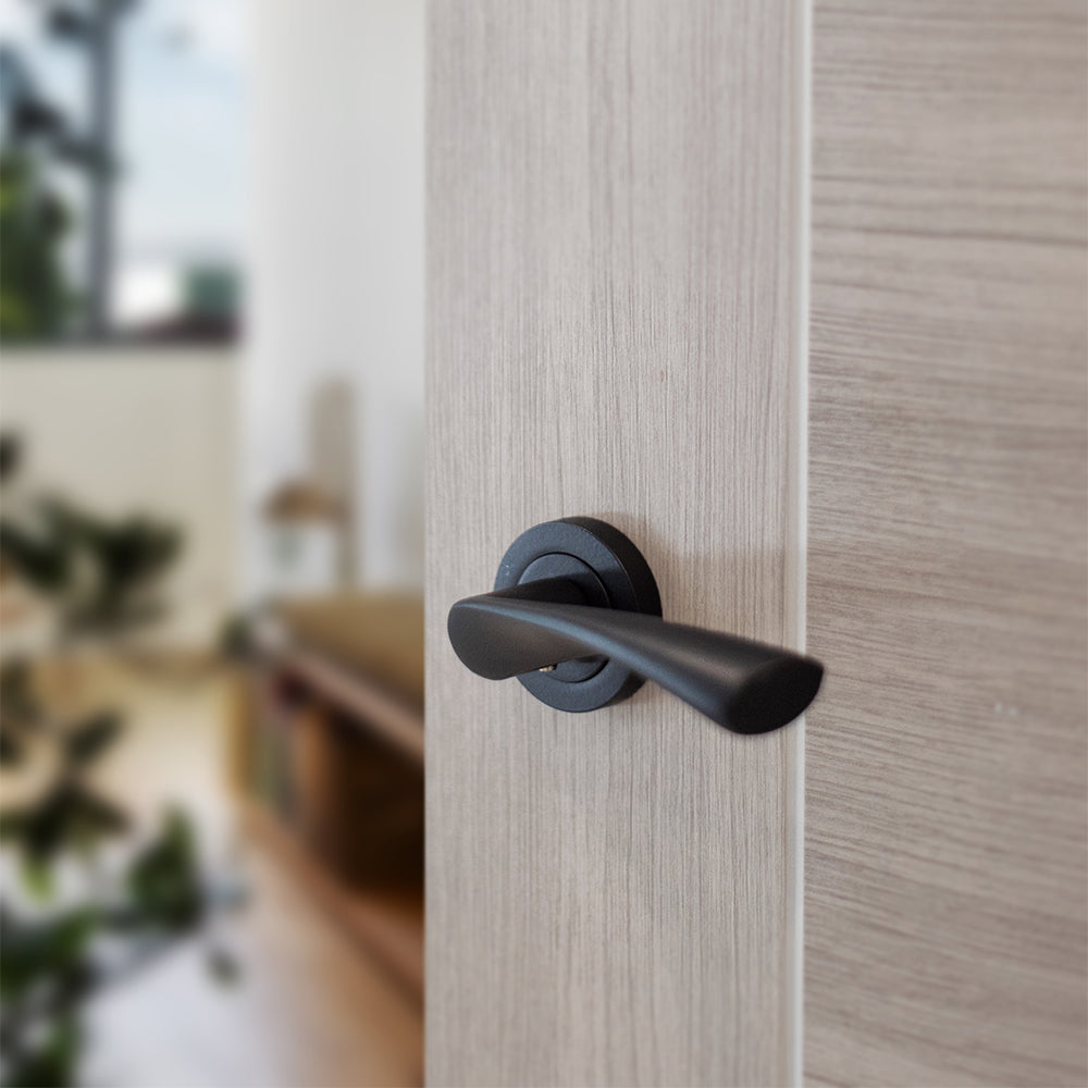 Quality image of STATUS Colorado Lever Door Handle on Round Rose - Matt Black | Sku. s34rmb | available from Trade Door Handles.