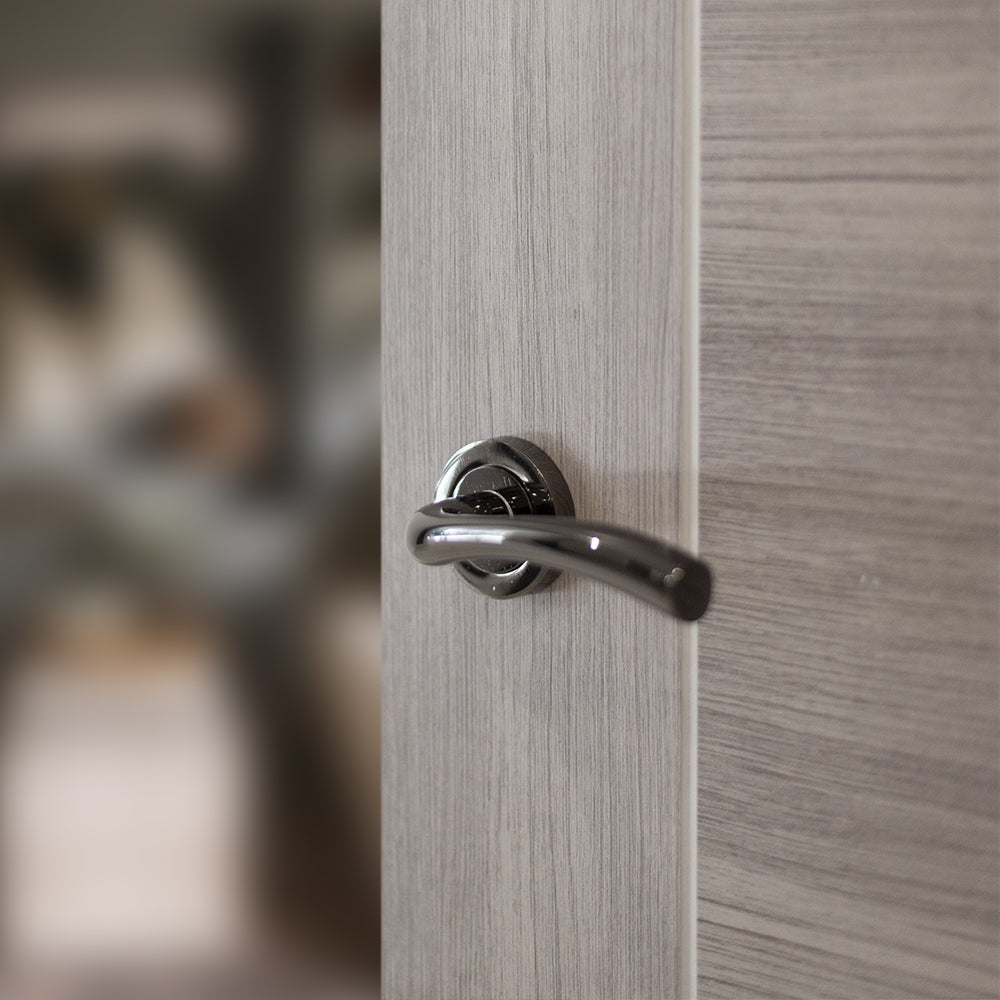 Quality image of STATUS Texas Lever Door Handle on Round Rose - Black Nickel | Sku. s35rbn | available from Trade Door Handles.