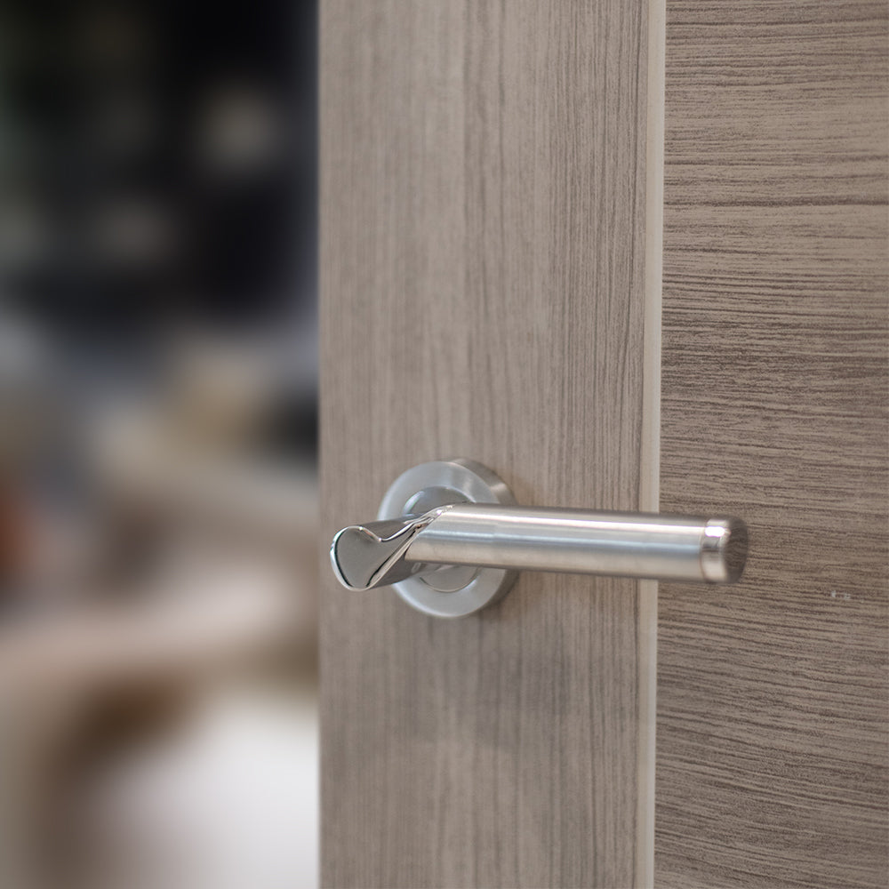 Quality image of STATUS Hawaii Lever Door Handle on Round Rose - Satin Chrome/Polished Chrome | Sku. s38rscpc | available from Trade Door Handles.
