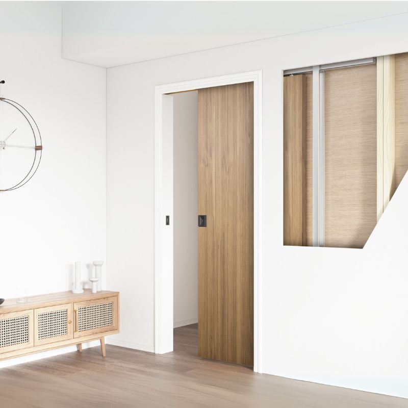 Single pocket door sliding into a concealed stud wall cavity