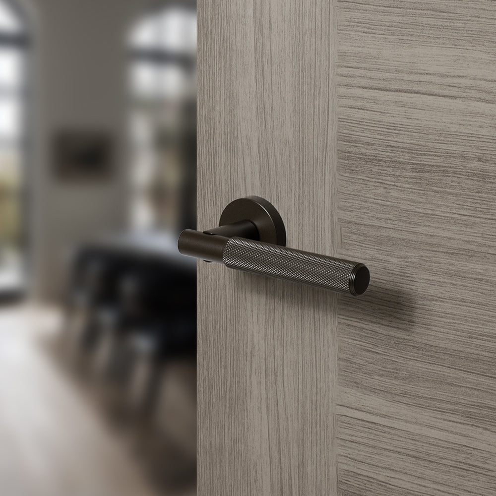 Quality image of Senza Pari Rosarno Knurled Lever Door Handle on Minimal Round Rose - Urban Dark Bronze | Sku. spr170udb | available from Trade Door Handles.