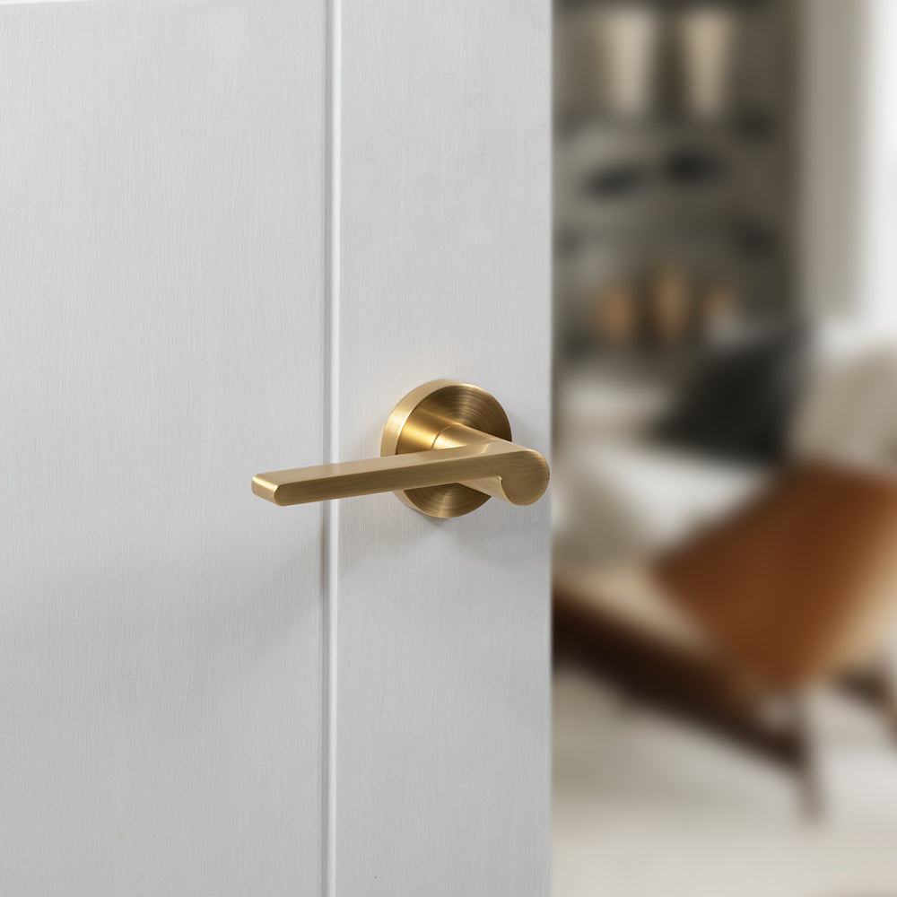 Quality image of Senza Pari Darrio Lever Door Handle on Round Rose - Satin Brass | Sku. spro218sb | available from Trade Door Handles.