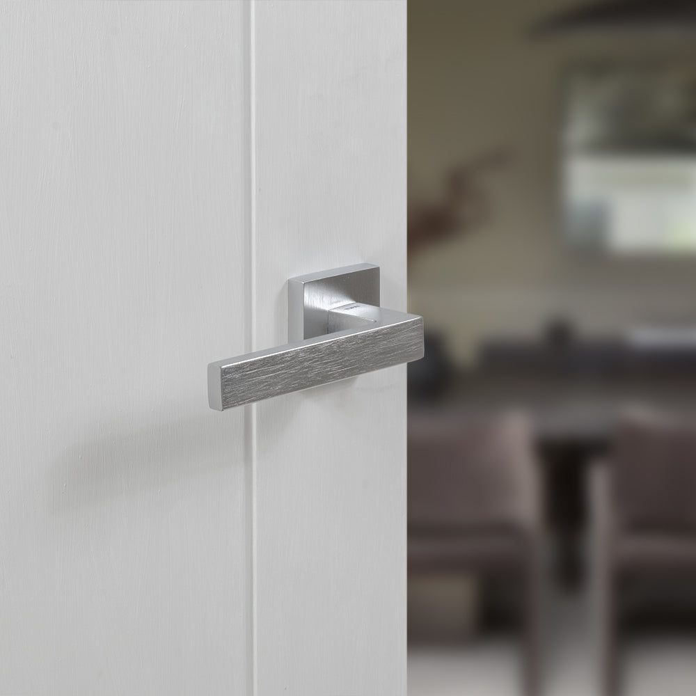 Quality image of Tupai Rapido QuadraLine Rillo Lever Door Handle on Square Rose - Satin Chrome | Sku. t2275ssc | available from Trade Door Handles.