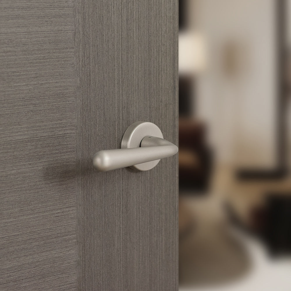 Quality image of Tupai Rapido CurvaLine Adra Lever Door Handle on Round Rose - Pearl Nickel | Sku. t293rpl | available from Trade Door Handles.