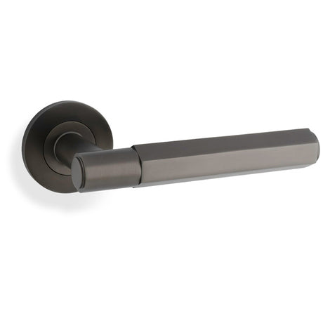 This is an image showing Alexander & Wilks - Spitfire Hex Lever on Round Rose - Dark Bronze aw224dbz available to order from Trade Door Handles in Kendal, quick delivery and discounted prices.