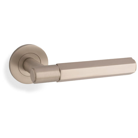This is an image showing Alexander & Wilks - Spitfire Hex Lever on Round Rose - Satin Nickel aw224sn available to order from Trade Door Handles in Kendal, quick delivery and discounted prices.
