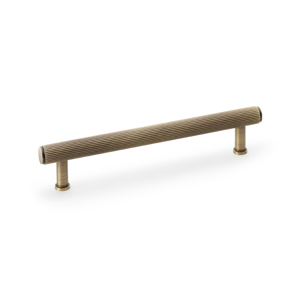High quality image of Alexander & Wilks Crispin Reeded T-bar Cupboard Pull Handle - Antique Brass - 160mm | Sku. aw809r-160-ab | Trade Door Handles.