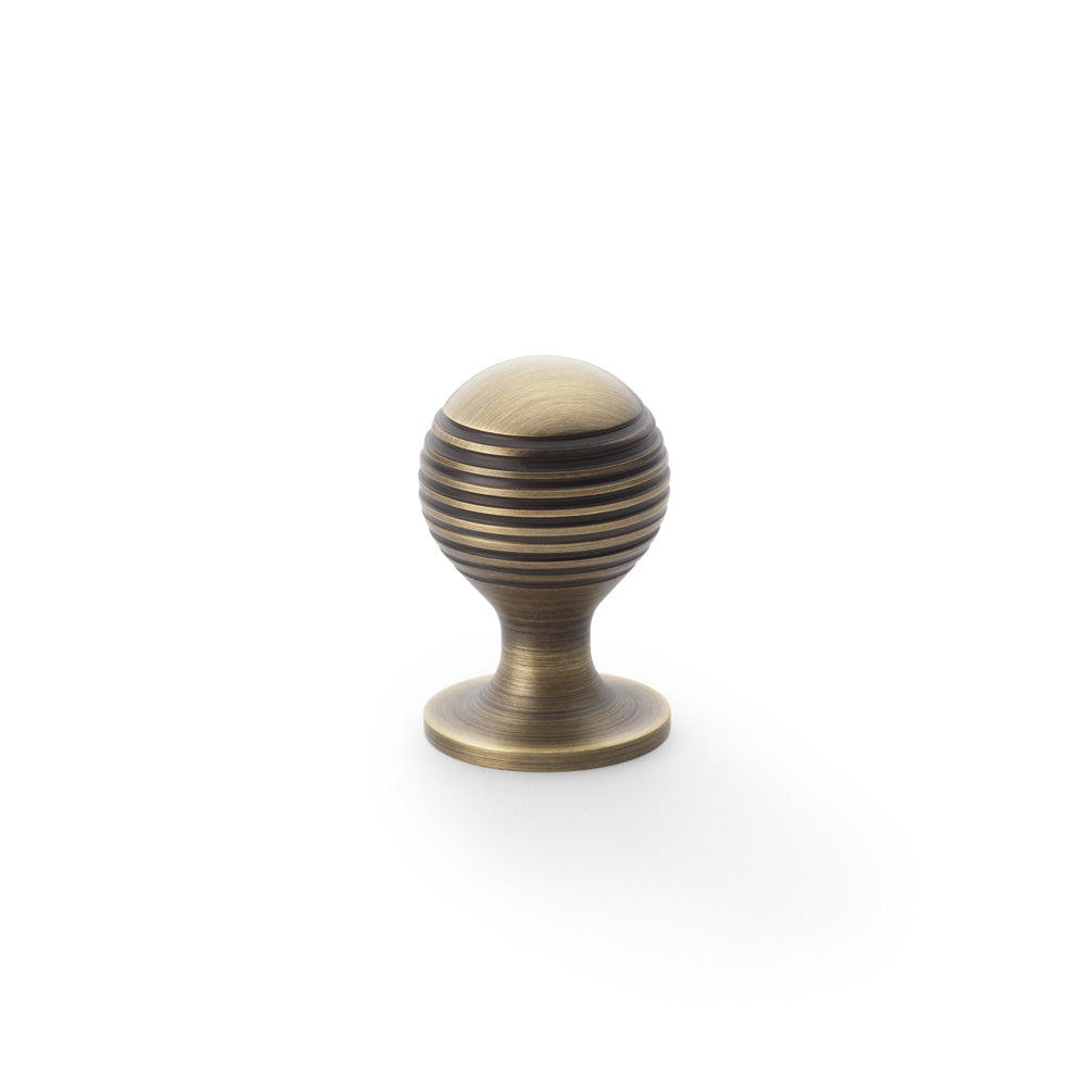High quality image of Alexander & Wilks Caesar Cupboard Knob on Round Rose - Antique Brass - 25mm | Sku. aw832-25-ab | Trade Door Handles.