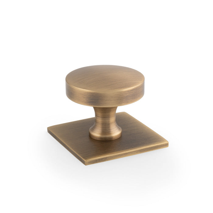 High quality image of Alexander & Wilks - Bullion Cupboard Knob on Square Backplate-Antique Brass | Sku. aw835-38-ab | Trade Door Handles.