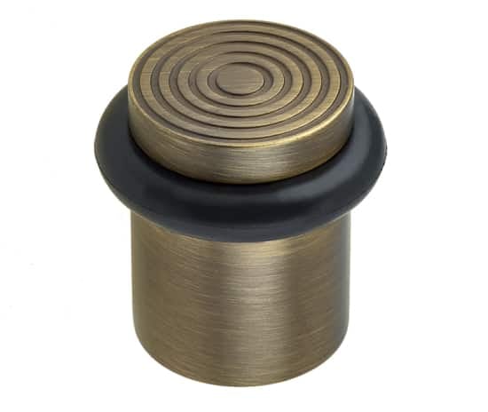 High quality image of Burlington - Reeded Door Stops Antique Brass Sku. BUR963AB
