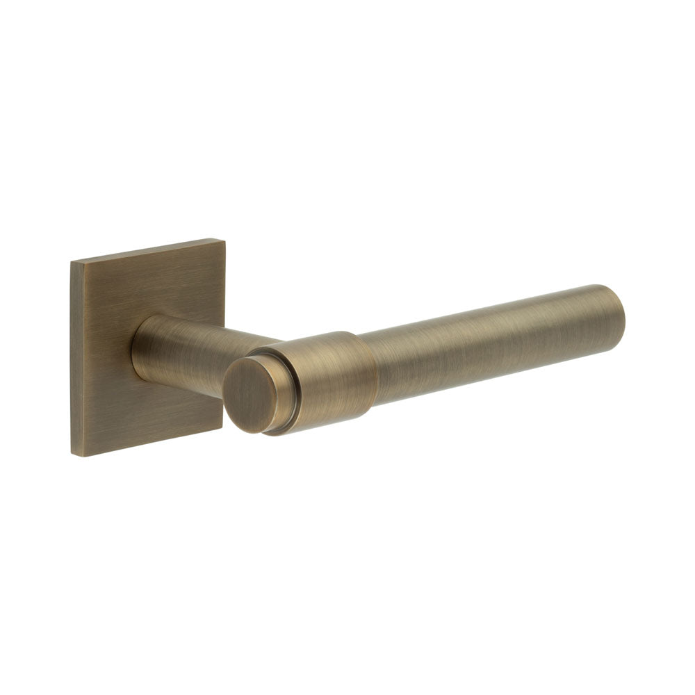 High quality image of CRES - CR-103 Antique Brass Sprung Square Rose Door Handle Sku. CR-103B1AB