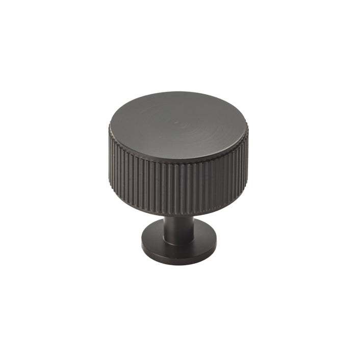 High quality image of Carlisle Brass - Lines Radio Knob - Matt Black | Sku. ftd713mb | Trade Door Handles.