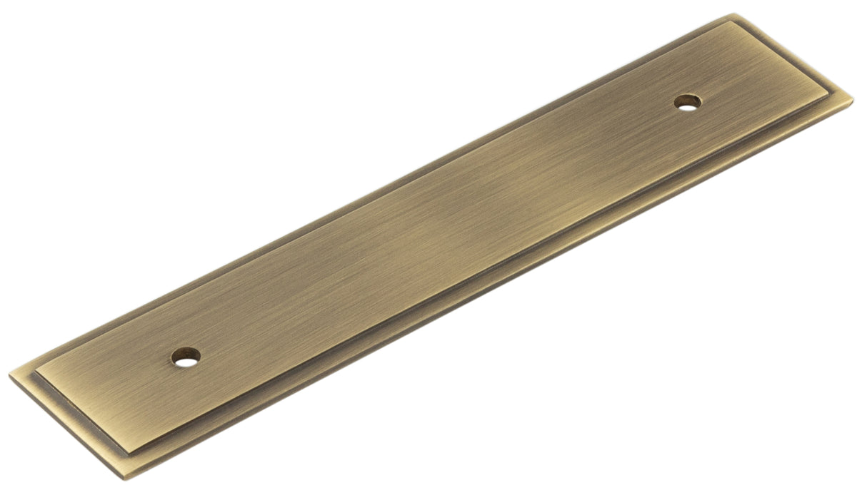 High quality image of Hoxton - Rushton Backplate for Cabinet Handles 140x30mm Antique Brass Sku. HOX6050AB