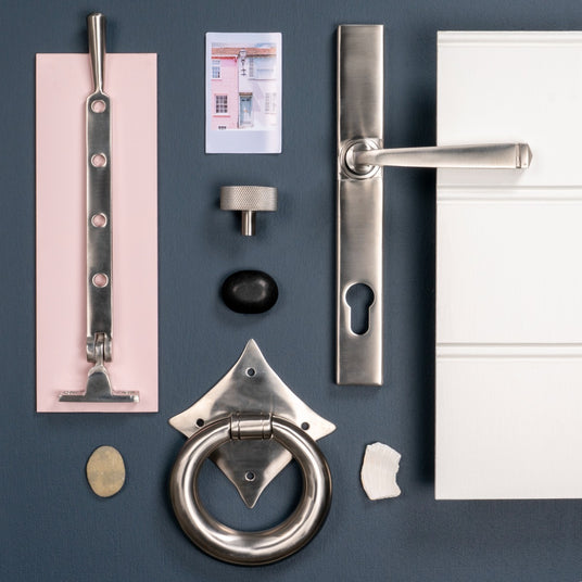 This is an image of a range of From The Anvil Satin Stainless Steel hardware on a mood board.  Available to order from Trade Door Handles in Kendal