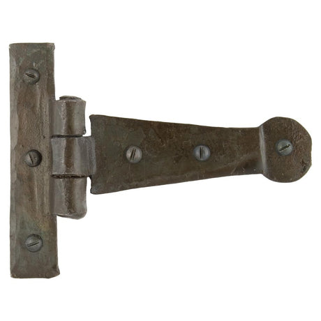 This is an image showing From The Anvil - Beeswax 4" Penny End T Hinge (pair) available from trade door handles, quick delivery and discounted prices