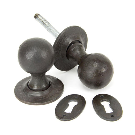 This is an image showing From The Anvil - Beeswax Round Mortice/Rim Knob Set available from trade door handles, quick delivery and discounted prices