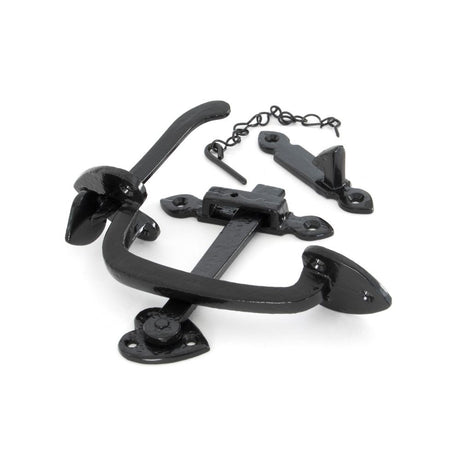 This is an image showing From The Anvil - Black Cast Thumblatch Set with Chain available from trade door handles, quick delivery and discounted prices