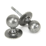 This is an image showing From The Anvil - Pewter Round Mortice/Rim Knob Set available from trade door handles, quick delivery and discounted prices