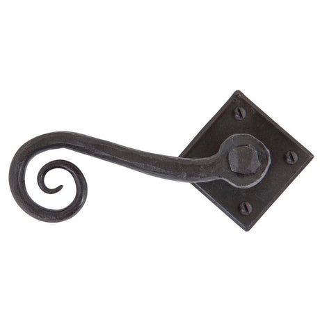 This is an image showing From The Anvil - Beeswax Monkeytail Lever on Rose Set (Diamond) available from trade door handles, quick delivery and discounted prices