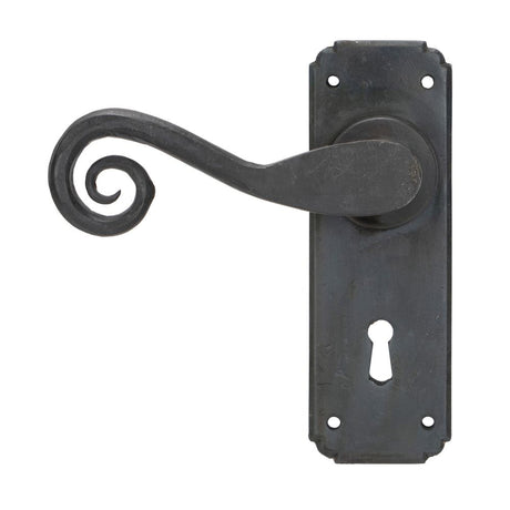 This is an image showing From The Anvil - Beeswax Monkeytail Lever Lock Set available from trade door handles, quick delivery and discounted prices
