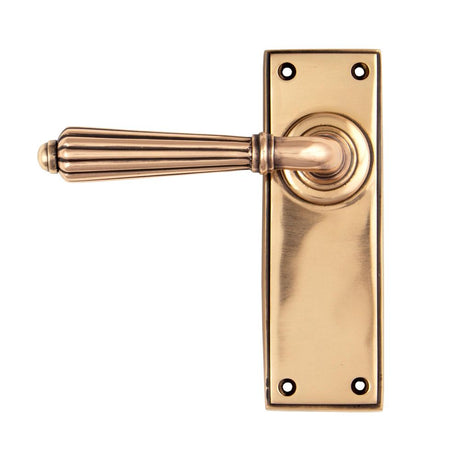 This is an image showing From The Anvil - Polished Bronze Hinton Lever Latch Set available from trade door handles, quick delivery and discounted prices
