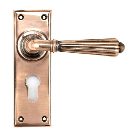 This is an image showing From The Anvil - Polished Bronze Hinton Lever Euro Lock Set available from trade door handles, quick delivery and discounted prices