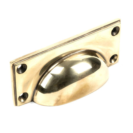 This is an image showing From The Anvil - Aged Brass Art Deco Drawer Pull available from trade door handles, quick delivery and discounted prices