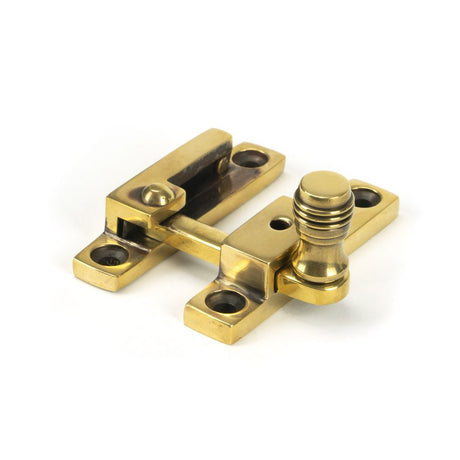 This is an image showing From The Anvil - Aged Brass Prestbury Quadrant Fastener - Narrow available from trade door handles, quick delivery and discounted prices