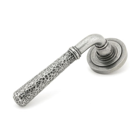 This is an image showing From The Anvil - Pewter Hammered Newbury Lever on Rose Set (Art Deco) available from trade door handles, quick delivery and discounted prices