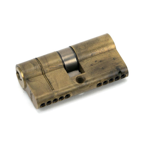 This is an image showing From The Anvil - Aged Brass 30/30 5pin Euro Cylinder available from trade door handles, quick delivery and discounted prices