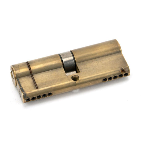 This is an image showing From The Anvil - Aged Brass 40/40 5pin Euro Cylinder available from trade door handles, quick delivery and discounted prices