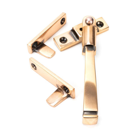 This is an image showing From The Anvil - Polished Bronze Night-Vent Locking Avon Fastener available from trade door handles, quick delivery and discounted prices