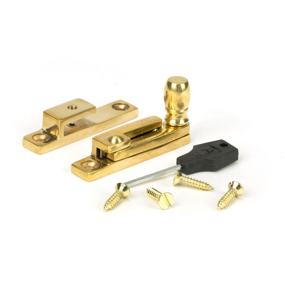 This is an image showing From The Anvil - Polished Brass Mushroom Quadrant Fastener - Narrow available from trade door handles, quick delivery and discounted prices