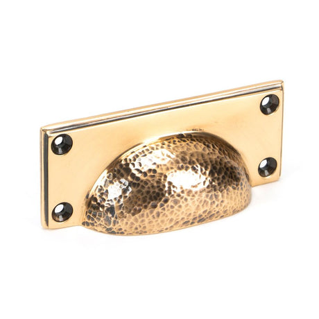 This is an image showing From The Anvil - Polished Bronze Hammered Art Deco Drawer Pull available from trade door handles, quick delivery and discounted prices