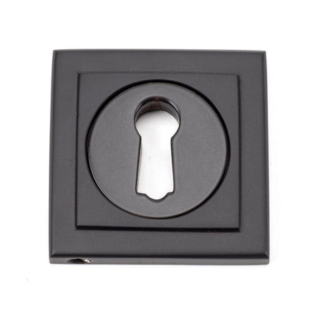 This is an image showing From The Anvil - Aged Bronze Round Escutcheon (Square) available from trade door handles, quick delivery and discounted prices
