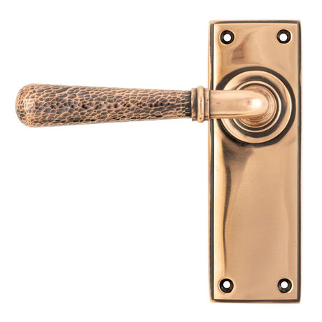 This is an image showing From The Anvil - Polished Bronze Hammered Newbury Lever Latch Set available from trade door handles, quick delivery and discounted prices
