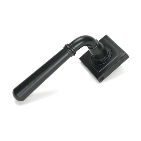 This is an image showing From The Anvil - Matt Black Newbury Lever on Rose Set (Square) available from trade door handles, quick delivery and discounted prices