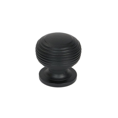 This is an image showing From The Anvil - Matt Black Beehive Cabinet Knob 30mm available from trade door handles, quick delivery and discounted prices