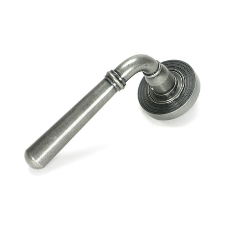 This is an image showing From The Anvil - Pewter Newbury Lever on Rose Set (Beehive) available from trade door handles, quick delivery and discounted prices