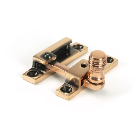 This is an image showing From The Anvil - Polished Bronze Prestbury Quadrant Fastener - Narrow available from trade door handles, quick delivery and discounted prices
