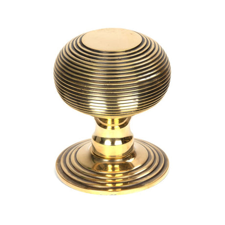 This is an image showing From The Anvil - Aged Brass Beehive Centre Door Knob available from trade door handles, quick delivery and discounted prices