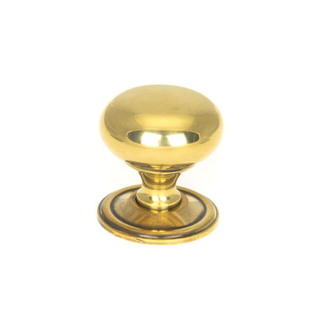 This is an image showing From The Anvil - Aged Brass Mushroom Cabinet Knob 38mm available from trade door handles, quick delivery and discounted prices