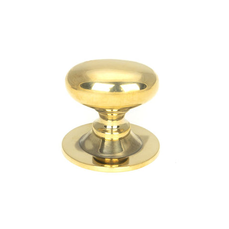 This is an image showing From The Anvil - Aged Brass Oval Cabinet Knob 33mm available from trade door handles, quick delivery and discounted prices