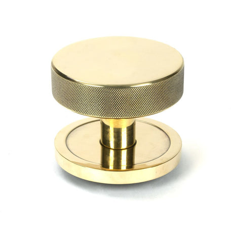 This is an image showing From The Anvil - Aged Brass Brompton Centre Door Knob (Plain) available from trade door handles, quick delivery and discounted prices