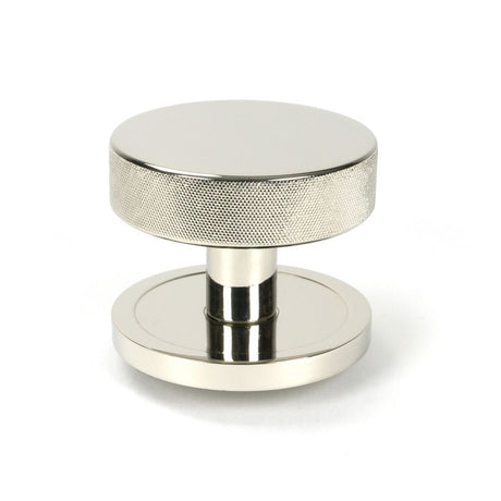 This is an image showing From The Anvil - Polished Nickel Brompton Centre Door Knob (Plain) available from trade door handles, quick delivery and discounted prices